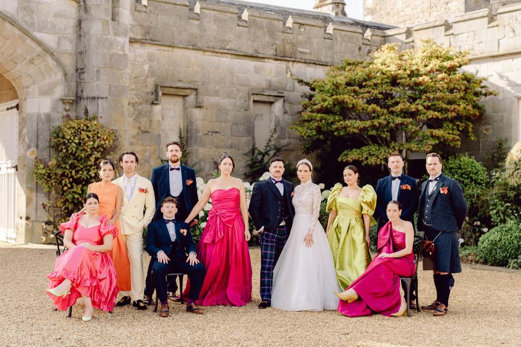 The Morris bridal party featuring a variety of colourful bridesmaid dresses and formal kilt outfits tailored by Nice Alter.
