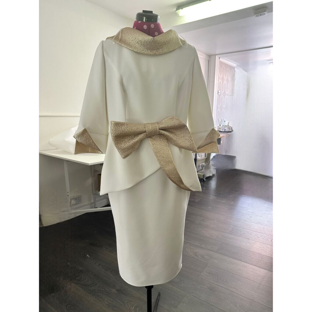 ophisticated two-piece outfit for mother of the bride after professional alterations.