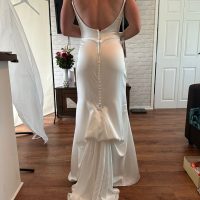 Original wedding dress design with thin straps before custom tailoring modifications.