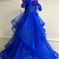 Dramatic multi-layered blue tulle prom dress after custom shortening and re-balancing by Nice Alter.